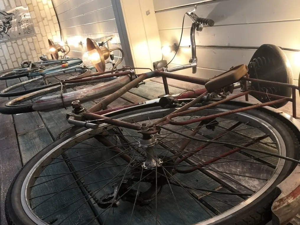 A vintage bike mounted on a wooden wall